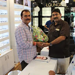 Lenstrack Optical Store in front of Raj Kumar College