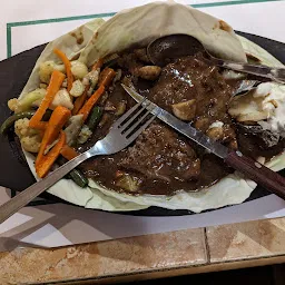 Tangerine Sizzlers Steak and More